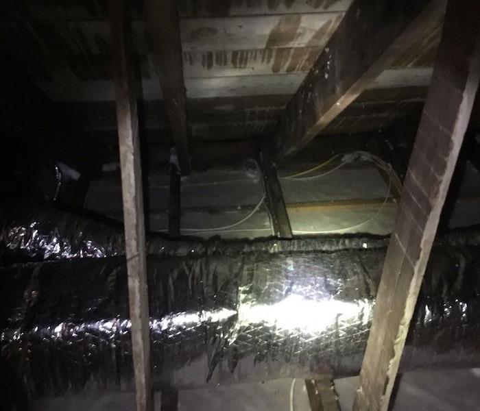 Attic with blown insulation and duct work